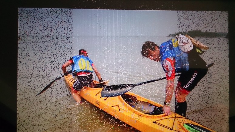 Team mates Marcel and Simone entering their kayak