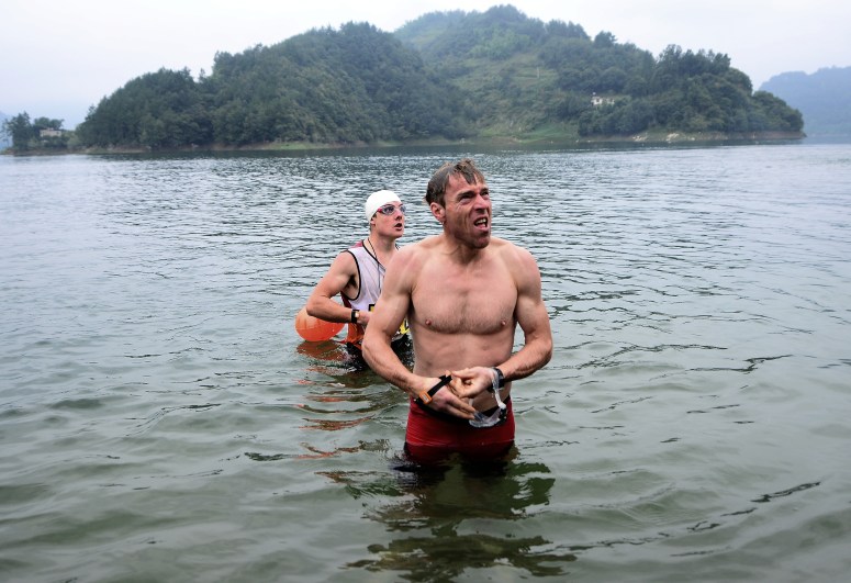 Marcel and I getting told off for warming up in the lake prior to the start of Day 3